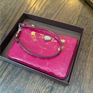 Coach Fuchsia Wristlet with Embossed Design
